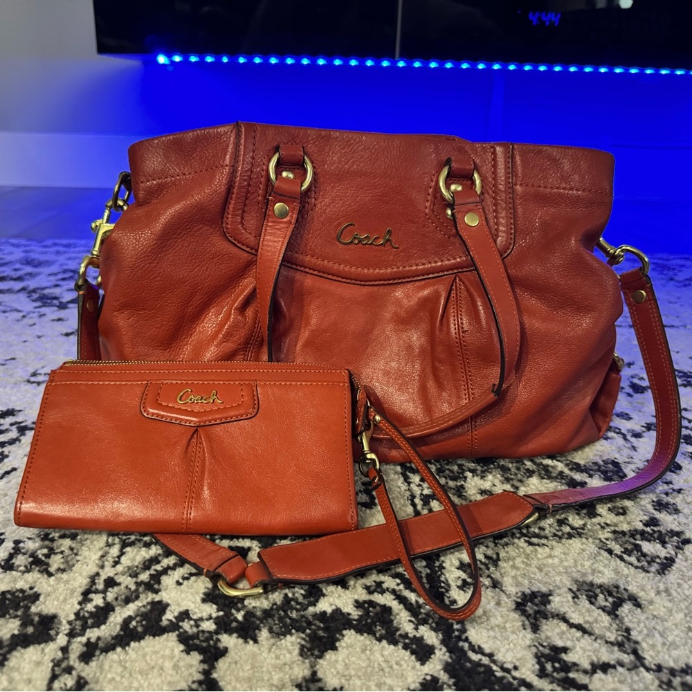 Beautiful authentic orange Coach purse and matching wallet